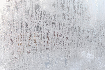Snow pattern on the surface of frozen window glass.
