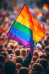 group of people raising the gay flag - obrazy, fototapety, plakaty