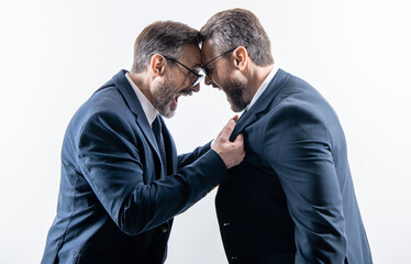 two businessmen fighting at rivalry isolated on white. unethical practice. businessmen having...