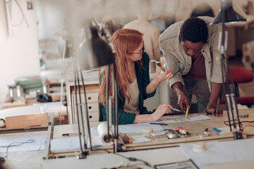 Young people working on group project in office