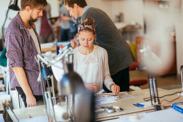 Young people working on group project in office