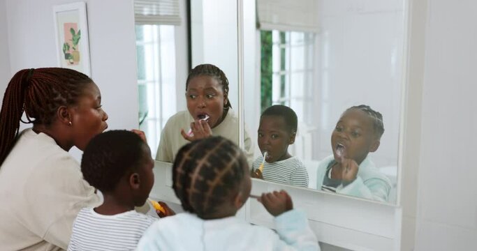 African mother, children and brushing teeth in bathroom with learning, care and together for hygiene in house. Mom, kids and toothbrush for wellness, dental cleaning and health in black family home