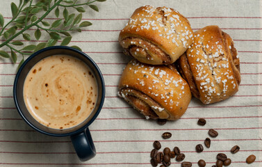 Cinnamon rolls and coffee on the table