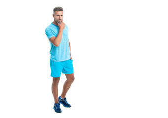 Athletic mature sport man standing, banner. Sport man standing wearing gym sportswear. Handsome sport man after workout in studio. runner sport man isolated on white background