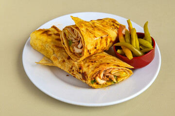 Turkish and Arabic Traditional Ramadan doner kebab with tasty tomato sauce and rice or turkish pilav in white plate on wood table background. ( Pilav ustu et doner, Hatay tavuk doner iskender kebap )
