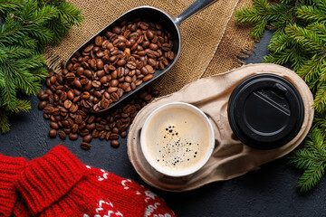 Coffee cup and fir tree branches in cozy setting