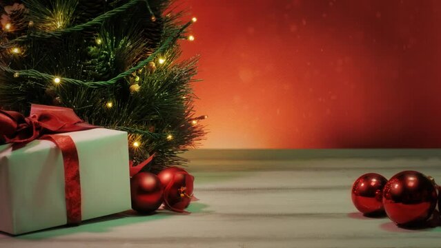 Christmas tree with presents and flashing lights. A product placement template with copy space . A video loop background, ideal for packshots or even text and season's greetings 