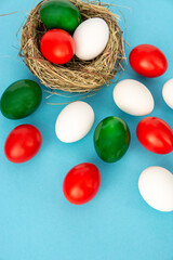 Fototapeta na wymiar Happy Easter holiday card, Easter eggs as the color of the Italy Italian flag green, red, white.