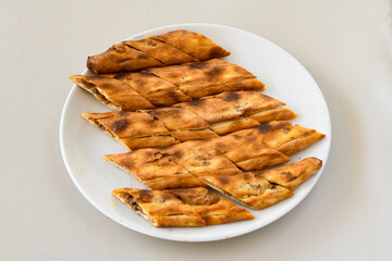Kiymali pide.Turkish pide with minced meat. Turkish pizza mince pita Pide on white background. Etli ekmek. Kusbasi kasarli, kiymali kasarli, kiymali yumurtali,  tirnak Trabzon, Bafra, Kusbasili pide.