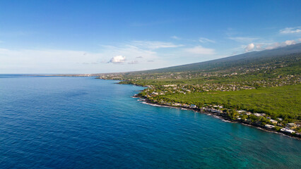 Drone photos off the the Big Island, Hawaii along the coast line with a beautiful blue sky and water