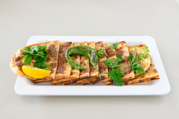 Kiymali pide.Turkish pide with minced meat. Turkish pizza mince pita Pide on white background. Etli ekmek. Kusbasi kasarli, kiymali kasarli, kiymali yumurtali,  tirnak Trabzon, Bafra, Kusbasili pide.