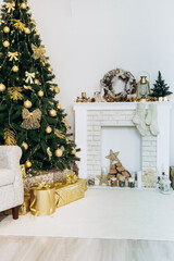 Cozy flat apartment photo studio room green Christmas Tree gifts presents garlands, candles decorated toys balls interior New Year lights glowing bokeh
