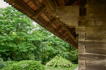 roof of an ancient orthodox ukrainian wooden church with nature on a background