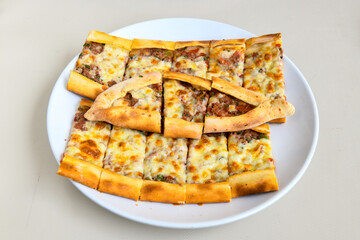 Kiymali pide.Turkish pide with minced meat. Turkish pizza mince pita Pide on white background. Etli ekmek. Kusbasi kasarli, kiymali kasarli, kiymali yumurtali,  tirnak Trabzon, Bafra, Kusbasili pide.