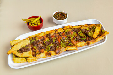 Kiymali pide.Turkish pide with minced meat. Turkish pizza mince pita Pide on white background. Etli ekmek. Kusbasi kasarli, kiymali kasarli, kiymali yumurtali,  tirnak Trabzon, Bafra, Kusbasili pide.