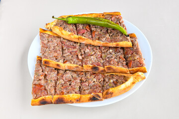 Kiymali pide.Turkish pide with minced meat. Turkish pizza mince pita Pide on white background. Etli ekmek. Kusbasi kasarli, kiymali kasarli, kiymali yumurtali,  tirnak Trabzon, Bafra, Kusbasili pide.