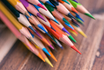 many color pencil on brown wood table background - Powered by Adobe