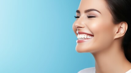 Fototapeta premium Smiling happy woman with white teeth standing on a blue background with lots of copy space on the right side created with Generative AI