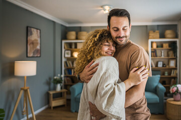Happy couple adult caucasian man woman husband and wife dance at home - Powered by Adobe