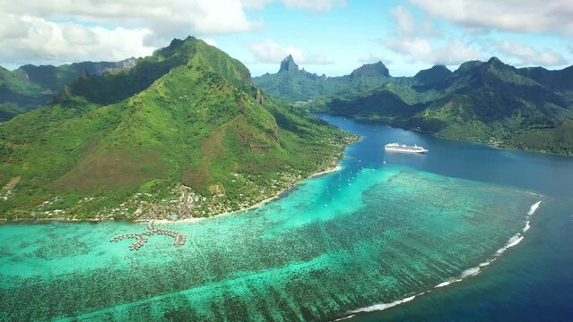 Drone Tahiti.  Aerial Moorea island, French Polynesia. Crystal clear water blue lagoon. Exotic travel vacation getaway, romantic honeymoon destination. Famous tourism destination. 