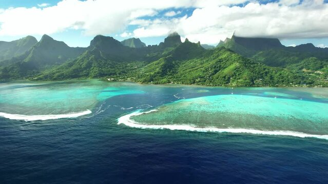 Drone Tahiti.  Aerial Moorea island, French Polynesia. Crystal clear water blue lagoon. Exotic travel vacation getaway, romantic honeymoon destination. Famous tourism destination. 