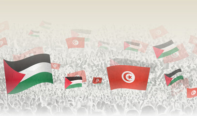 Palestine and Tunisia flags in a crowd of cheering people.