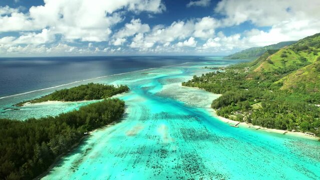 Drone Tahiti.  Aerial Moorea island, French Polynesia. Crystal clear water blue lagoon. Exotic travel vacation getaway, romantic honeymoon destination. Famous tourism destination. 