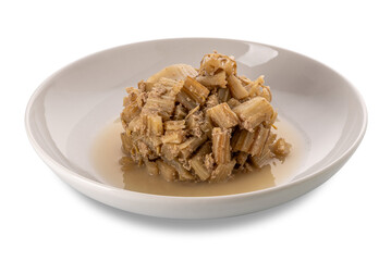 Stewed thistles with anchovy and garlic sauce in white plate isolated