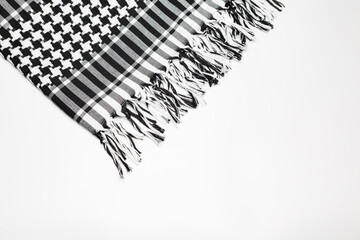 Keffiyeh or Pushi, head covering commonly used in the Middle East and the Arab World. Keffiyeh is a traditional garment tied to the head.