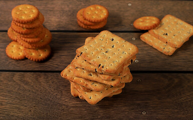 Dry french cracker with sesame seeds on wooden background.Homemade chocolate chip cookies with gluten free nuts,modern bakery concept. Healthy breakfast with ingredients, top view,