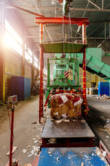 Obraz na płótnie Canvas Pressing and baling of wastepaper in recycling factory
