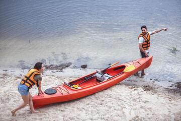 Fototapeta na wymiar Couple travelling by kayak