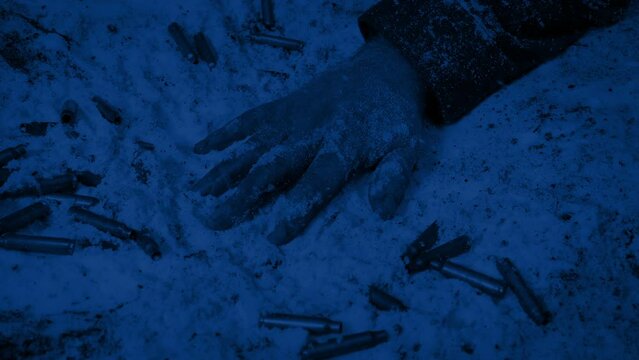 Arm Of Dead Soldier On Snowy Battlefield At Night
