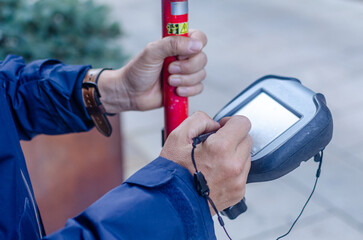 hands of a topographer using differential GPS