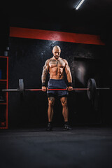 Man Doing Training With A Barbell At The Gym