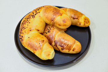 Turkish style meat stuffed filo dough borek served kol boregi. Cheese and minced pie are sliced on a marble background. Turkish name: Kol Boregi, ispanakli, kiymali, Su Boregi