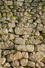 wall of irregular granite stone blocks, texture for backgrounds