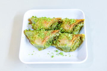 Turkish Dessert Sobiyet  Baklava, mussels baklava and classic baklava with Pistachio . Cevizli, Fistikli Baklava, top view.