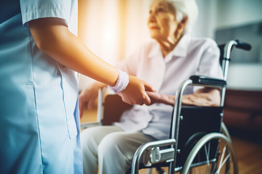 Portrait of nurse and her senior client on wheelchair