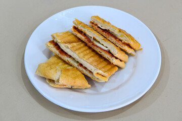 Turkish karisik atom  tost ( kasarli bazlama tost) . Sucuklu, Kasarli, kavurmali karisik tost. Flat baked bread toasted