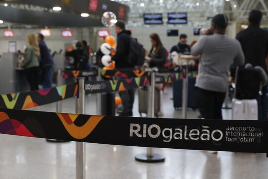 Tom Jobim International Airport Gale&atilde;o Rio de Janeiro.Riogale&atilde;o icon. Passengers in line at arline counter for bag drop and check-in boarding flights at Terminal 