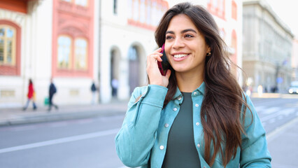 Young woman is talking on the phone