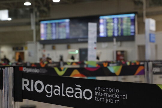 Tom Jobim International Airport Gale&atilde;o Rio de Janeiro.Riogale&atilde;o icon. Passengers in line at arline counter for bag drop and check-in boarding flights at Terminal 
