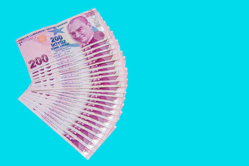 200 Turkish Liras arranged in quarter piece on a blue background