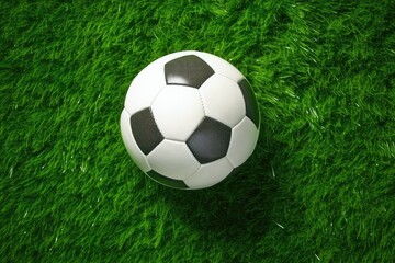 Top view of soccer ball on green artificial grass field