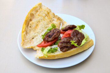 Meatball between bread (Turkish name : ekmek arasi kofte ) Izgara kofte. Manisa, Akcaabat, Akhisar  kofte