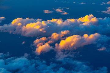 Billowing clouds stretch over the endless expanse of the ocean. The merging of sky and water...