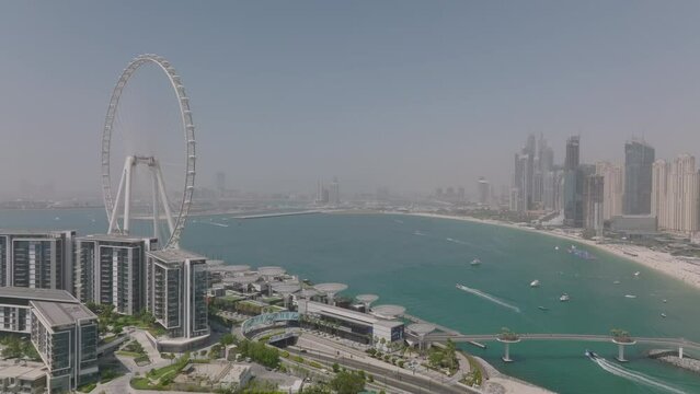 Aerial video of the Dubai Marina with the famous Ain Dubai giant wheel