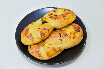 Turkish pastry product , tasty pogaca. Simit, gevrek. Turkish Pastries; peynirli, patatesli, kasarli pogaca, borek, acma, ay coregi at patisserie showcase.