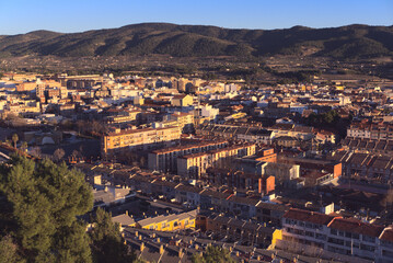 Aerial view of the city of Ibi, in the province of Alicante, Spain. Golden hour. Industrial and tourist town for its picturesque winter fest. High quality photo